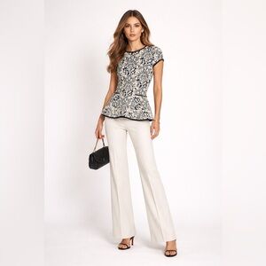 Valentina Shah black and white knit short sleeve peplum top. Estimated M.